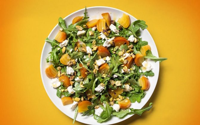 roasted golden beet and goat cheese salad with arugula and pistachios