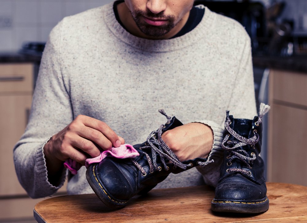 Man polishing shoes | Interesting Uses For WD-40 DIY Junkies Should Know