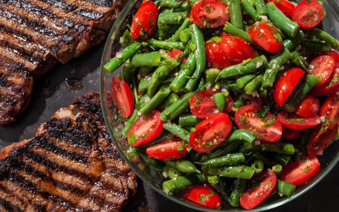 grilled steak with green bean and tomato salad