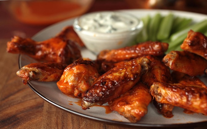 buffalo chicken wings with celery, carrots, and blue cheese dip