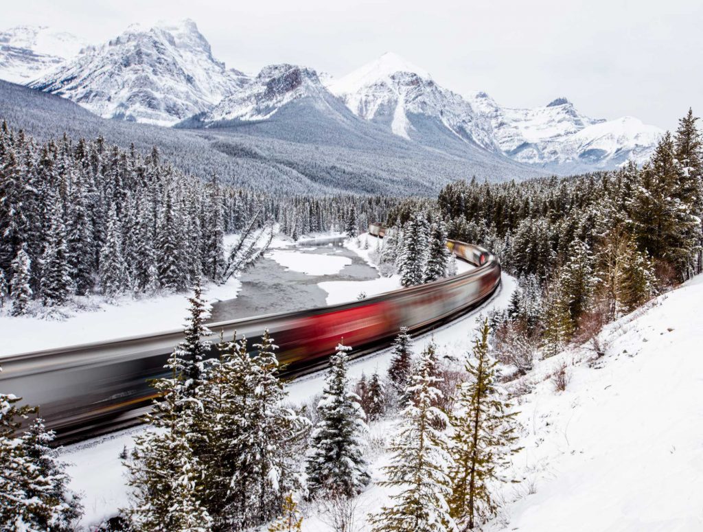 A train zooms through the popular Morant's Curve in Banff National Park, where photographers usually wait for hours to snap one whizzing by. A long exposure produced this dizzying blur of motion. &copy; Lori Kupsch. All rights reserved