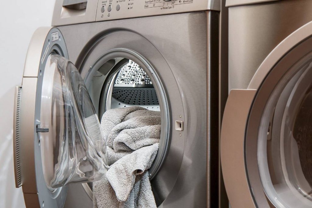 Wash your masks with any clothes you've worn outside. If you don't have enough to complete a load, keep them in a plastic bag separate from the rest of your laundry.
