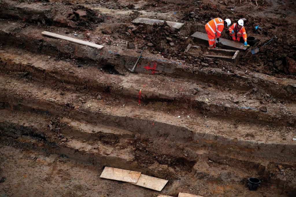 Workers exhume rows of graves near London&rsquo;s Euston Station, the terminus of a new train line.