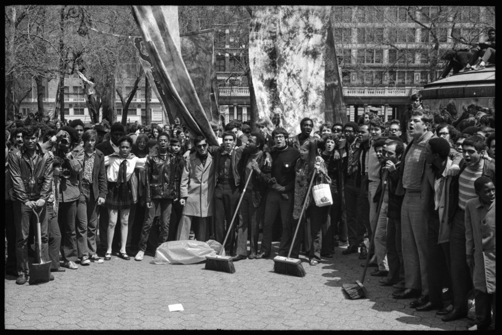 Cleanup crews gathered in New York City's Union Square Park on the first Earth Day. Energy company Con Edison donated brooms, mops, and other supplies.