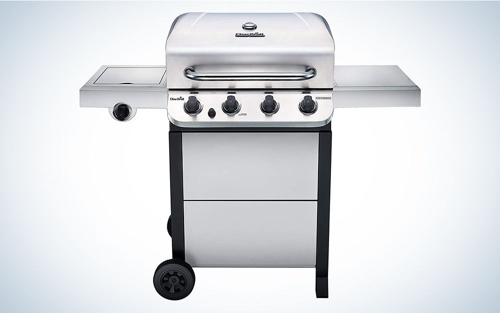 Stainless steel portable gas grill with side burner.