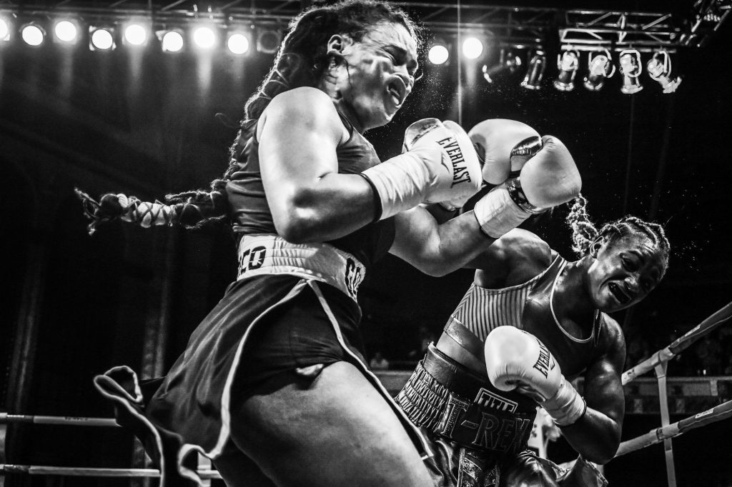Olympic middleweight boxing champion Claressa Shields (right) spars with Hanna Gabriels in a match at the Masonic Temple in Detroit, Michigan on June 22, 2018. Shields is the first American woman to win an Olympic gold medal in boxing and the first athlete to win back-to-back golds in successive Olympic Games.   &copy; ​Terrell Groggins. All rights reserved