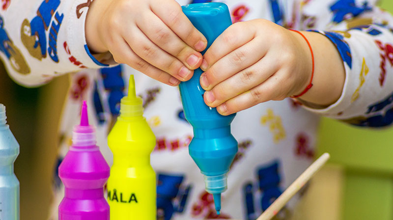 Child Squeezing Paint Out of a Tube | How To Teach Kids To Draw To Boost Their Creativity
