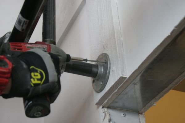 Mount the bottom left flange | How To Make A Bombproof Pullup Bar | DIY Fitness | DIY Pullup Bar